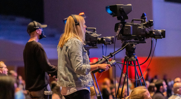 woman operating broadcast camera
